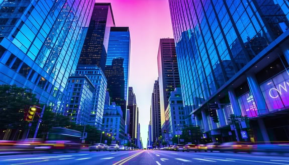 Towering skyscrapers loom overhead, bathed in an electric mix of blue and pink